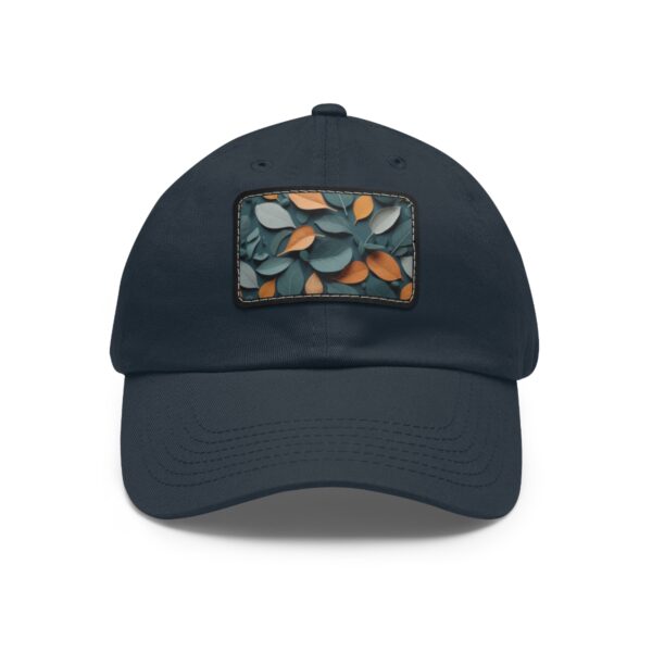 Dad Hat with stitched patch featuring a pattern of overlapping leaves in earthy tones.