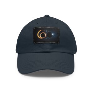 Dad Hat with stitched patch featuring a cosmic design of two overlapping solar eclipses with glowing effects.