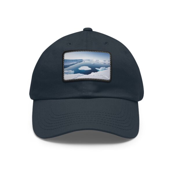 Dad Hat with stitched patch featuring a serene arctic landscape with clouds and an ice-filled ocean.