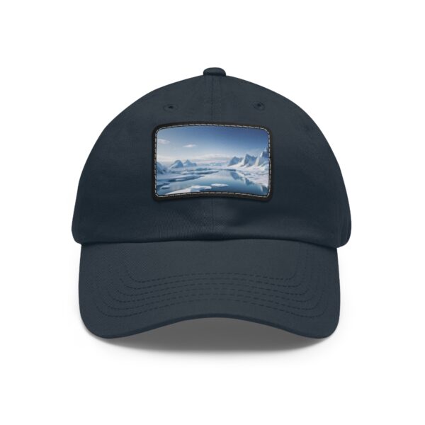 Dad Hat with rectangular patch featuring a serene icy landscape with snow-covered mountains and a clear blue sky