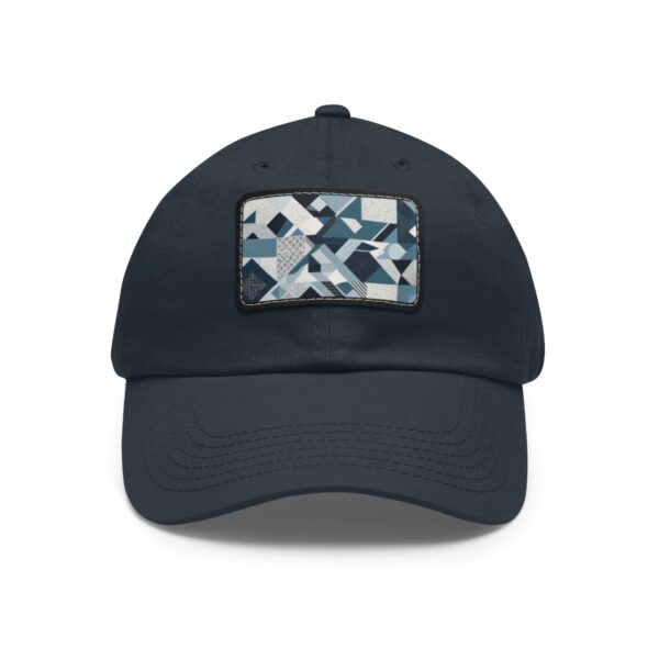 Dad Hat with stitched patch featuring a geometric pattern of overlapping triangles and rectangles in shades of blue, white, and gray.