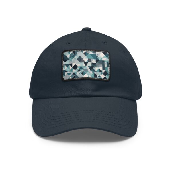 Dad Hat with stitched patch featuring an abstract geometric pattern of interlocking shapes in shades of blue, white, and gray.