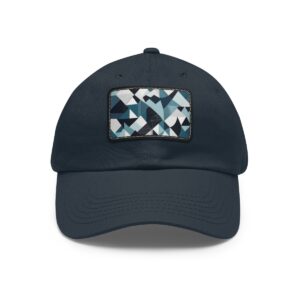 Dad Hat with stitched patch featuring a geometric pattern of triangles and rectangles in shades of blue, black, white, and gray.