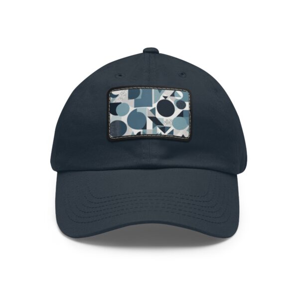 Dad Hat with stitched patch featuring a geometric abstract pattern of circles and rectangles in shades of blue, white, and gray.