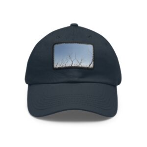 Dad Hat with stitched patch featuring a minimalist design of tree branches against a clear sky.