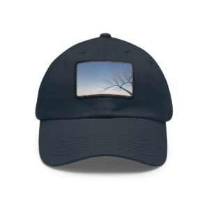 Dad Hat with stitched patch featuring a minimalist design of a single tree branch against a fading sky.