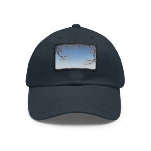 Dad Hat with stitched patch featuring a minimalist design of tree branches framing a clear sky.