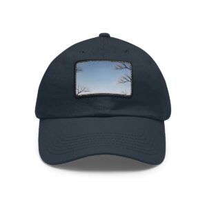 Dad Hat with stitched patch featuring a minimalist sky design with tree branches in the corners.