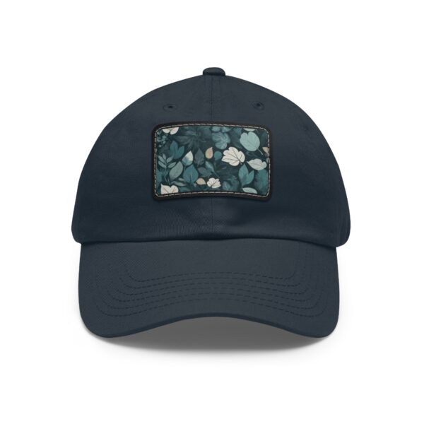 Dad Hat with stitched patch featuring a soft leaf pattern in shades of green and white.