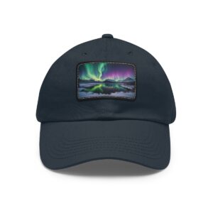 Dad Hat with rectangular patch featuring a vivid display of the Northern Lights over a reflective Arctic landscape