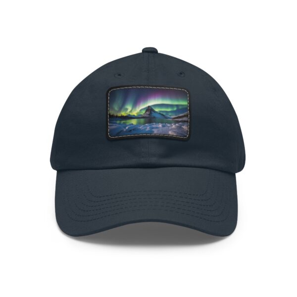 Dad Hat with rectangular patch showcasing a vibrant Northern Lights display over a serene Arctic landscape