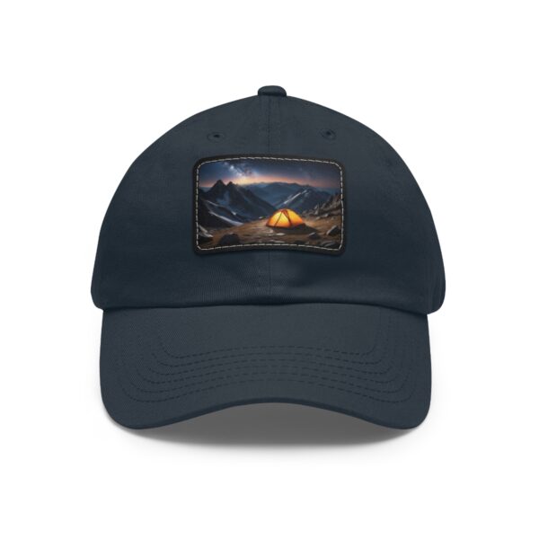 Dad Hat with rectangular patch featuring a glowing tent in a mountain landscape under a starry night sky