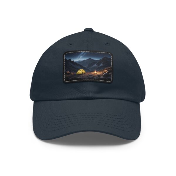 Dad Hat with rectangular patch featuring a glowing tent and campfire in a mountain valley under a starry night sky