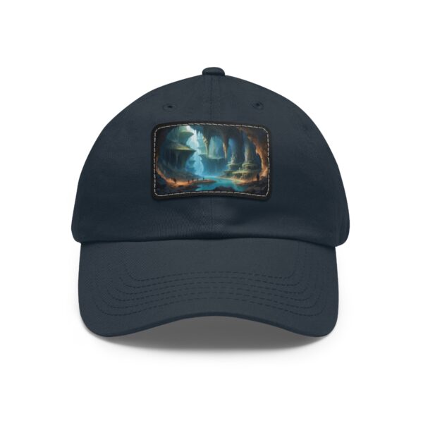 Dad Hat with rectangular patch featuring an underground lake with glowing blue waters and stalactites