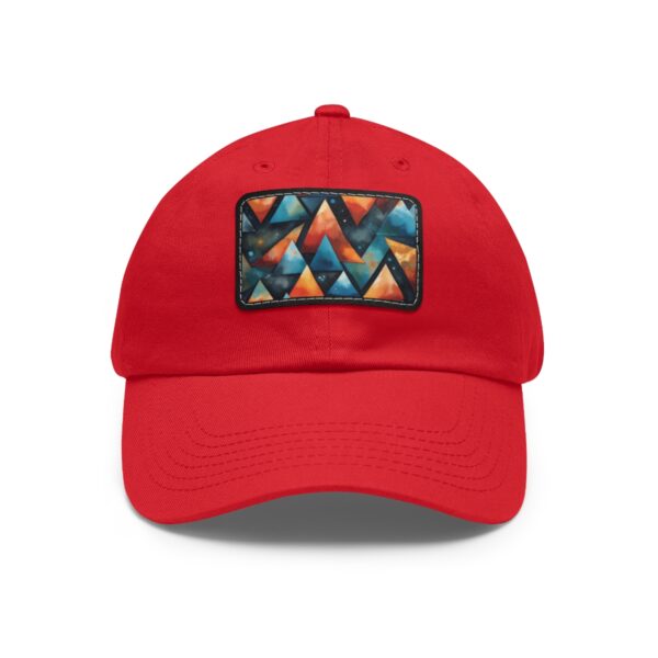 Red Dad Hat with stitched patch featuring a vibrant geometric pattern of colorful triangles in orange, blue, and yellow.