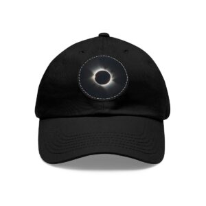 Dad Hat featuring a design of a total solar eclipse with a bright glowing ring around a dark center on front