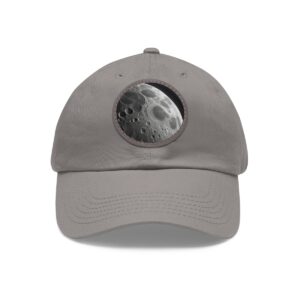 Dad Hat with round patch featuring a close-up of the Moon's surface with prominent craters and shadows