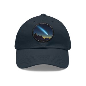 Dad Hat with comet design featuring a bright streak of light over a mountain landscape on front