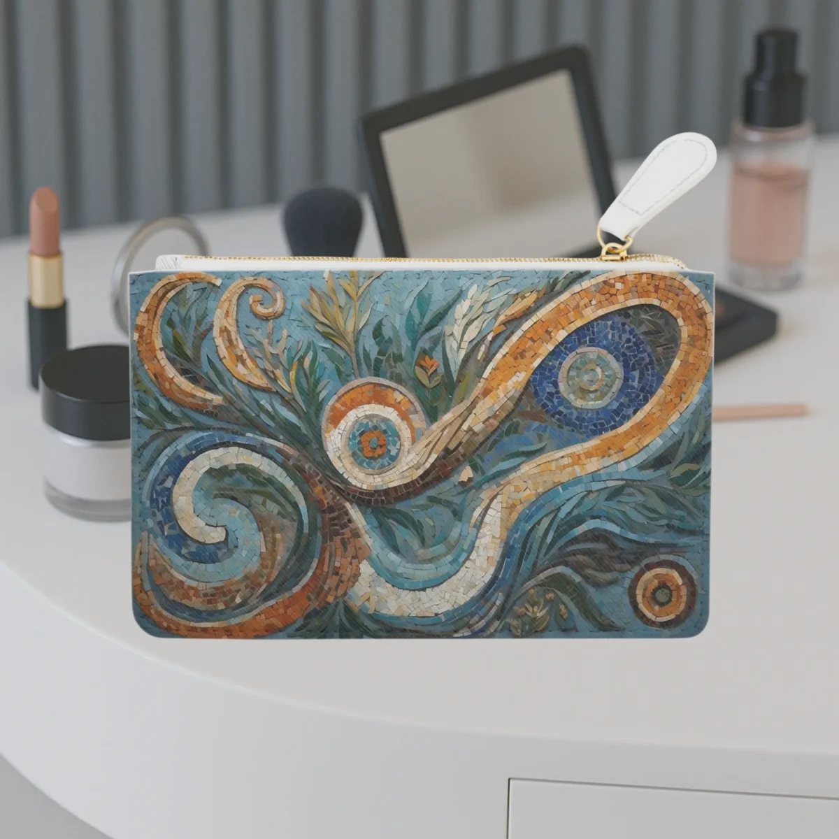 Mini clutch bag featuring a colorful biomorphic mosaic pattern displayed on a vanity table.