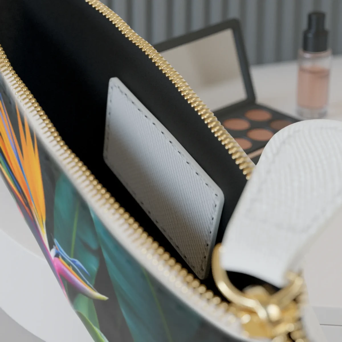 Close-up of the inside of the mini clutch bag featuring a visible inner pocket and floral edge print.