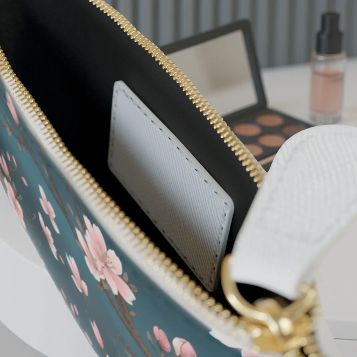 Close-up of the inside of the mini clutch bag showing the inner pocket and floral edge design.