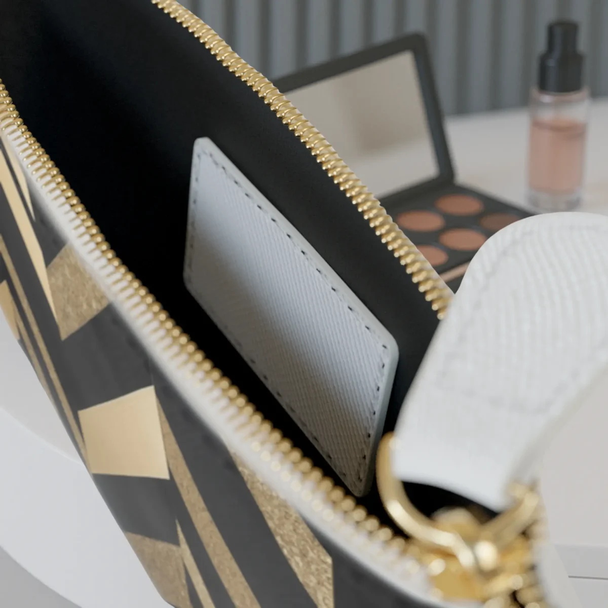 Close-up of the inside of the mini clutch bag showing the pocket and chevron pattern at the edge.