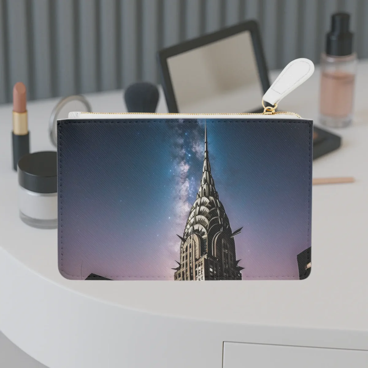 Mini clutch bag featuring the illuminated Chrysler Building spire against a twilight sky with stars.