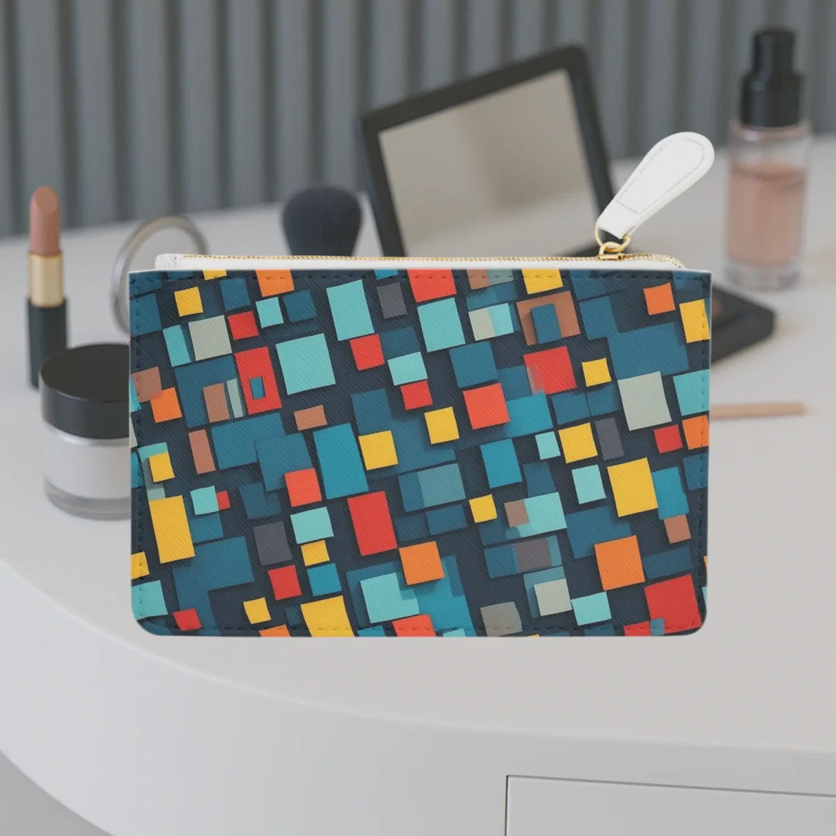 Mini clutch bag with colorful geometric abstraction design on a vanity