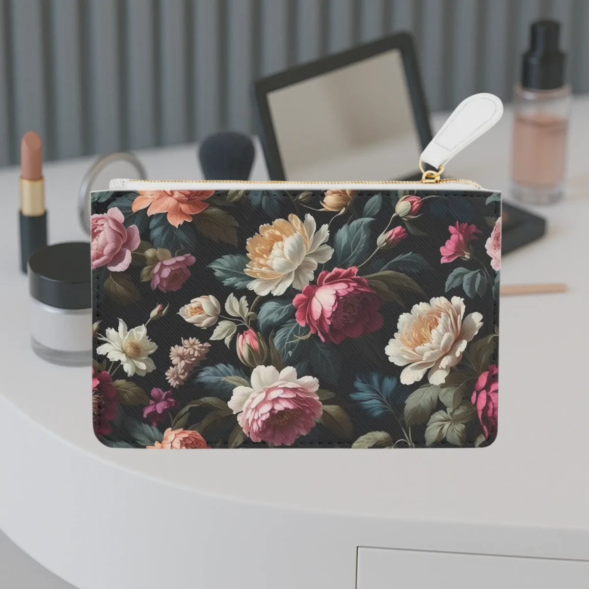 Mini clutch bag with vintage floral print displayed on a vanity table