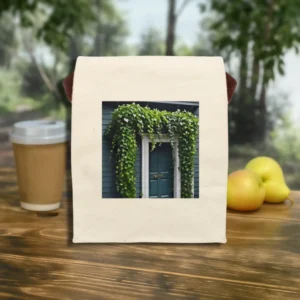 Front view of a canvas lunch bag with ivy-covered house entrance print.