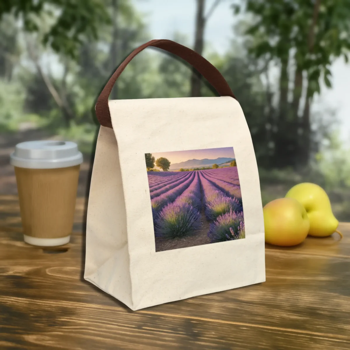Canvas lunch bag with a scenic lavender field print, placed outdoors on a wooden table.