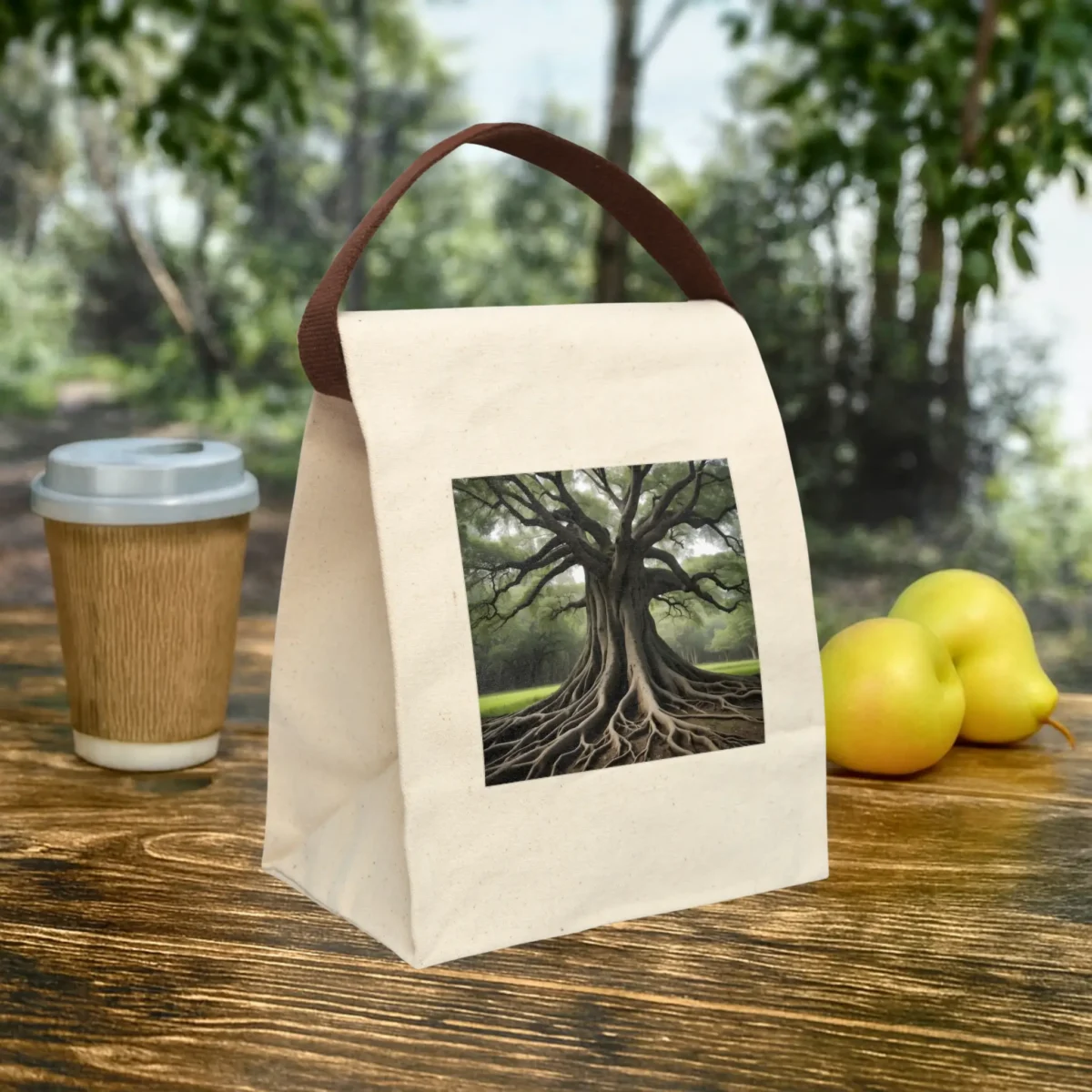 Canvas lunch bag with a printed artwork of a large tree and detailed root system, displayed outdoors.
