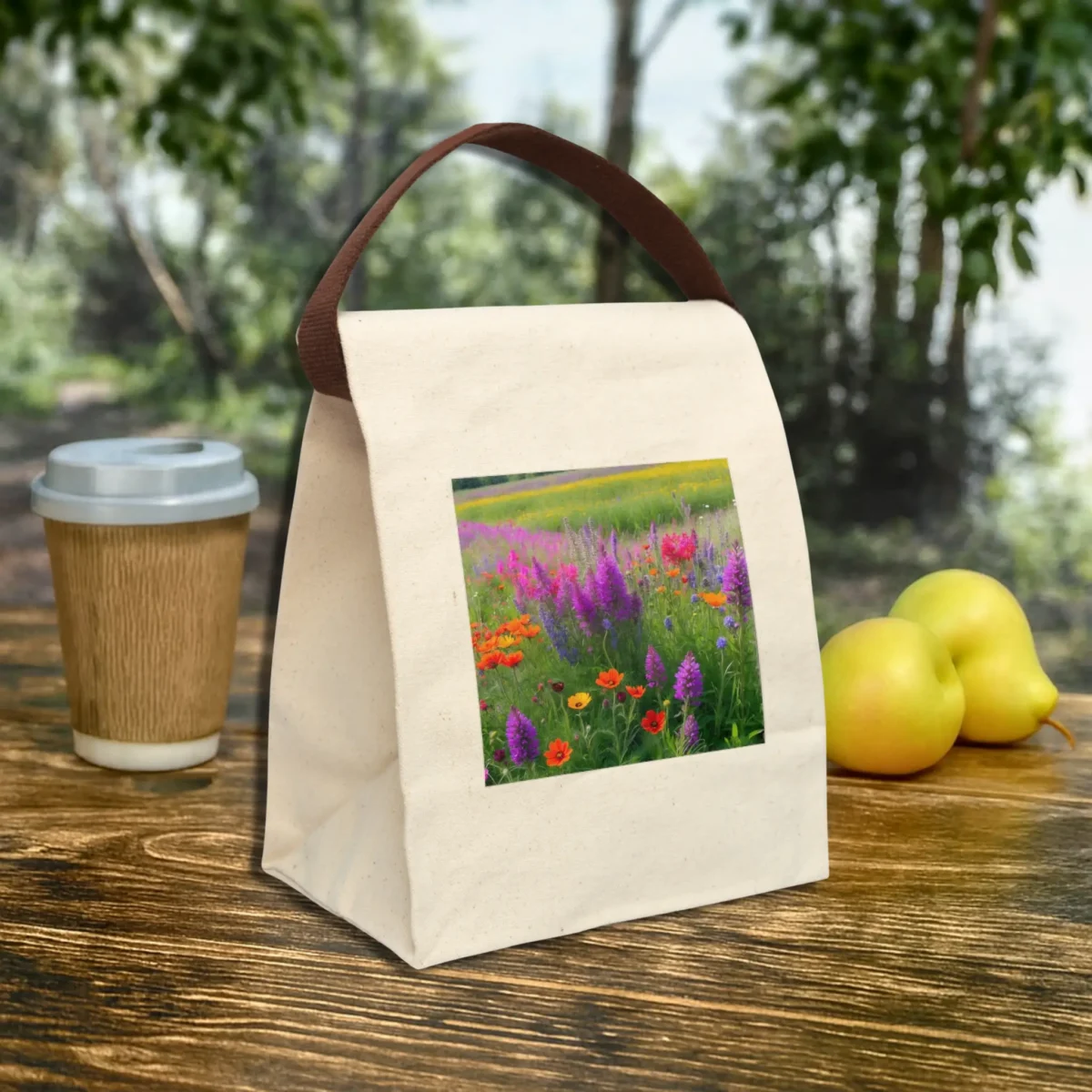 Angled canvas lunch bag with a wildflower meadow print on natural cotton