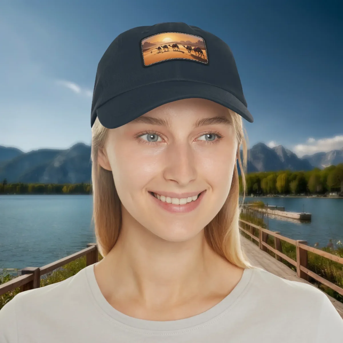 Woman wearing a navy baseball cap with camel caravan desert scene patch