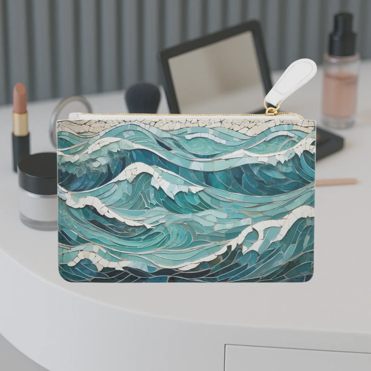 Mini clutch bag with an ocean wave mosaic pattern placed on a white vanity table