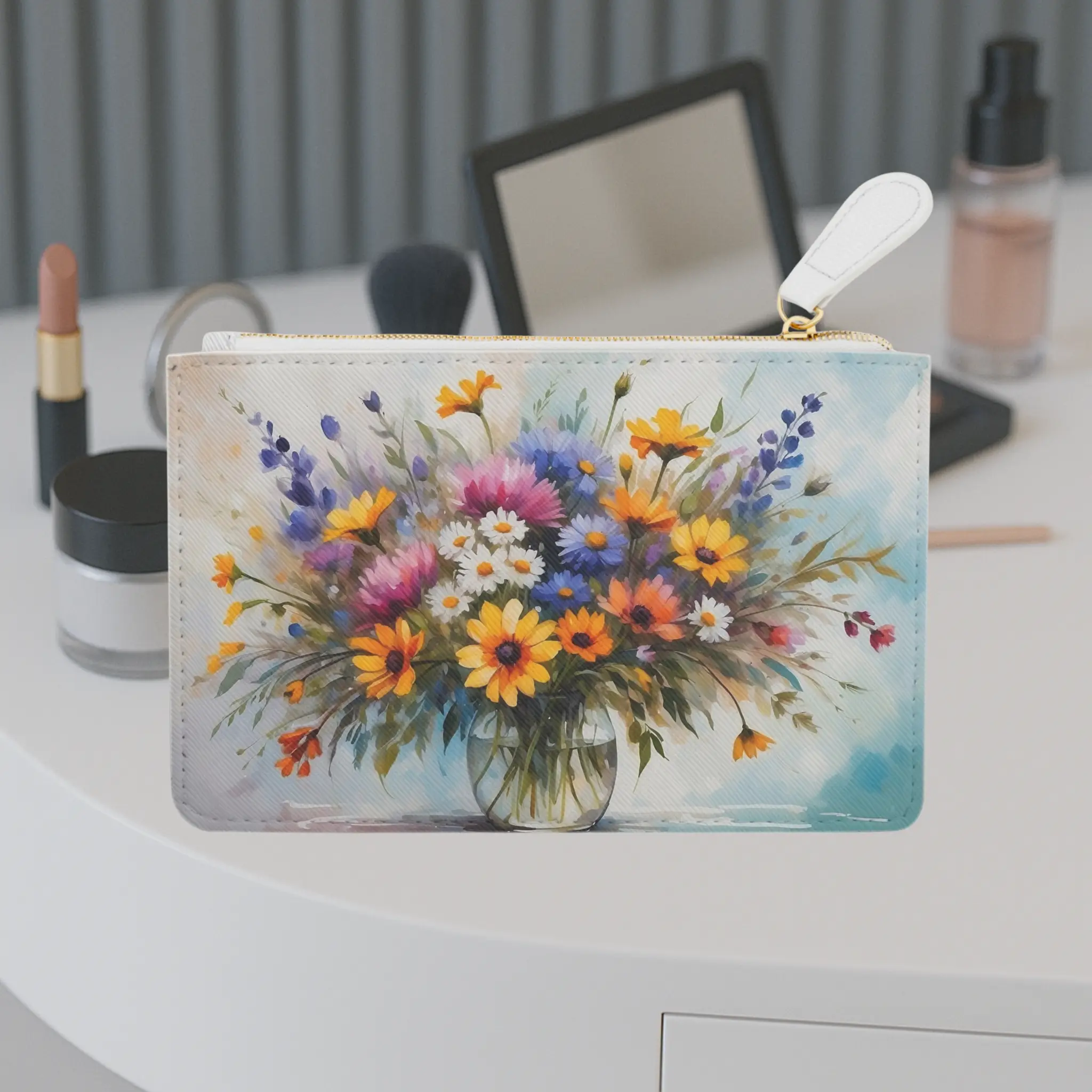 Wildflowers mini clutch bag front design Front view of the Wildflowers mini clutch bag featuring a vibrant bouquet of colorful wildflowers in a glass vase on a light background.