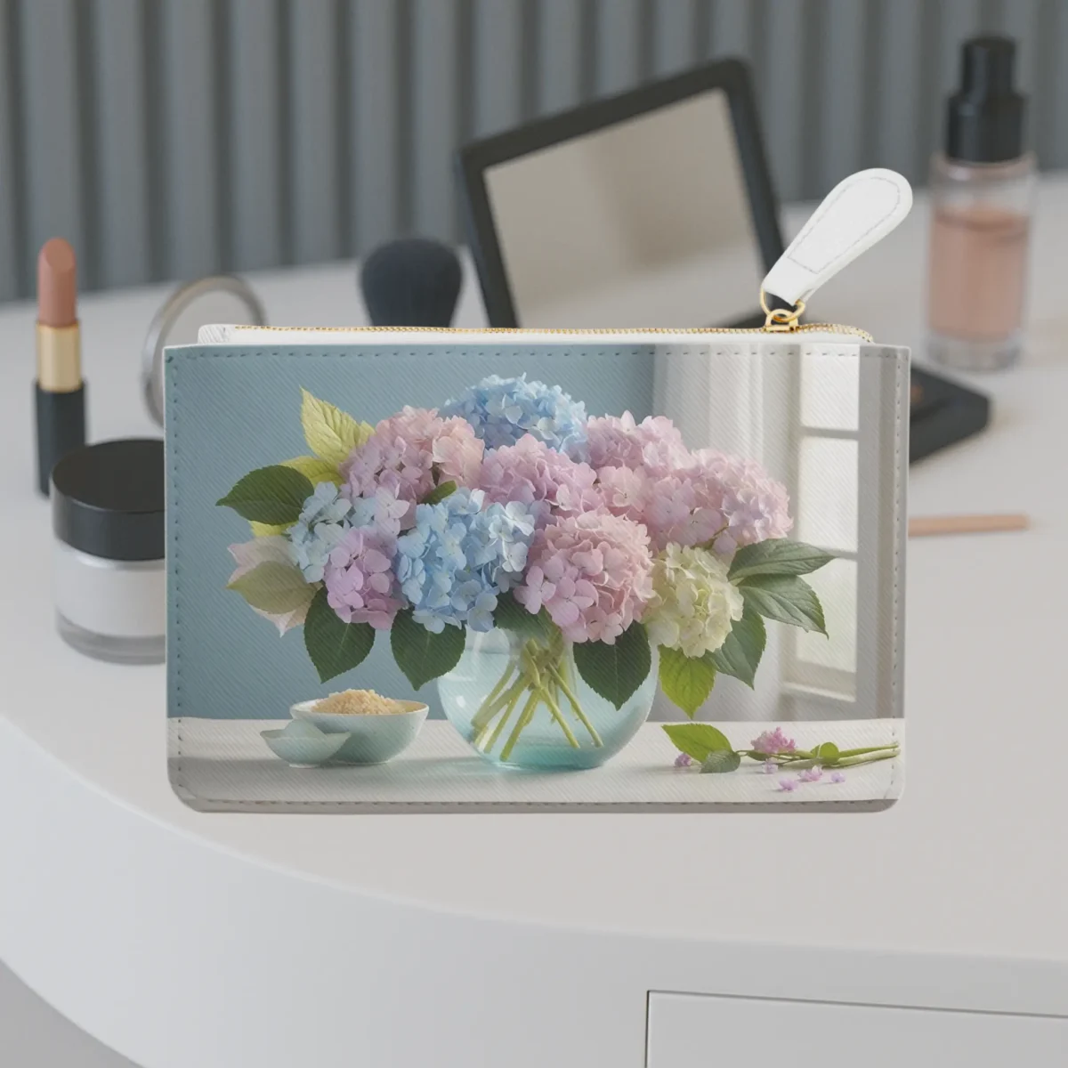 Mini clutch bag with pastel hydrangea bouquet design on a vanity table