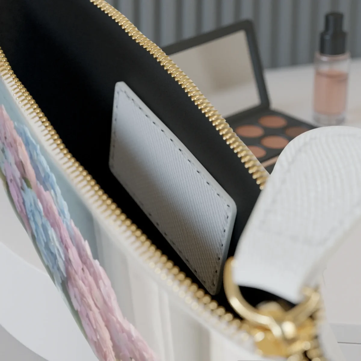 Interior view of mini clutch bag with hydrangea print and internal pocket