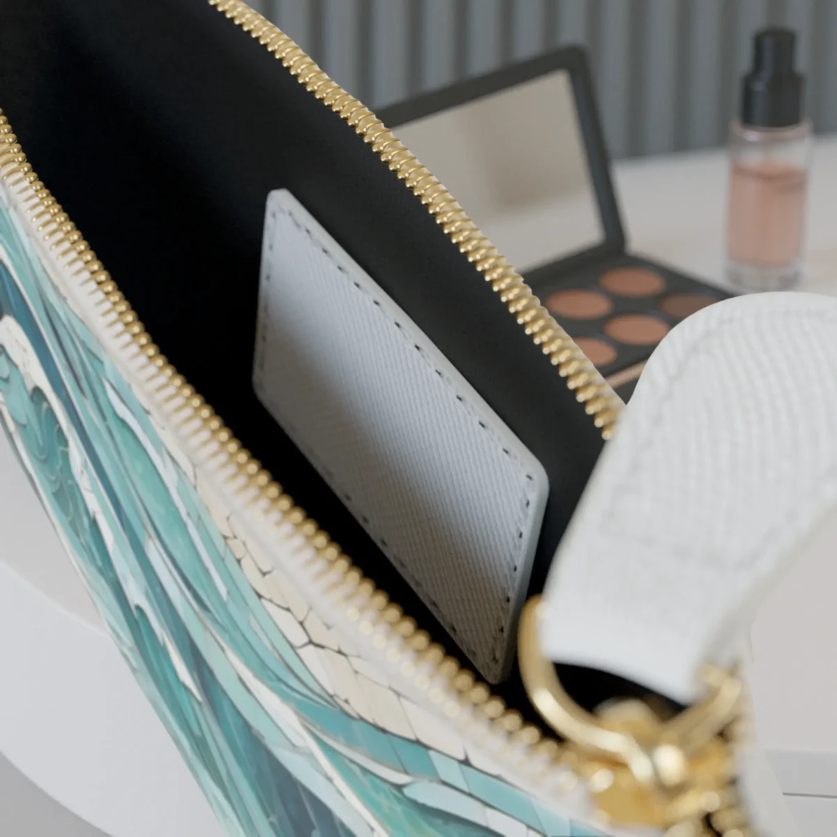 Interior of the mini clutch bag showing a card pocket and gold-tone zipper