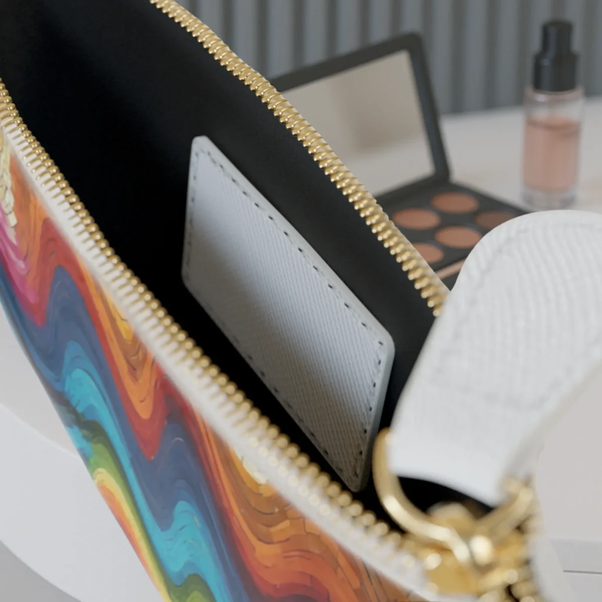 Close-up of the inside pocket of the Soundwave Mosaic mini clutch bag with visible zipper and white card slot.