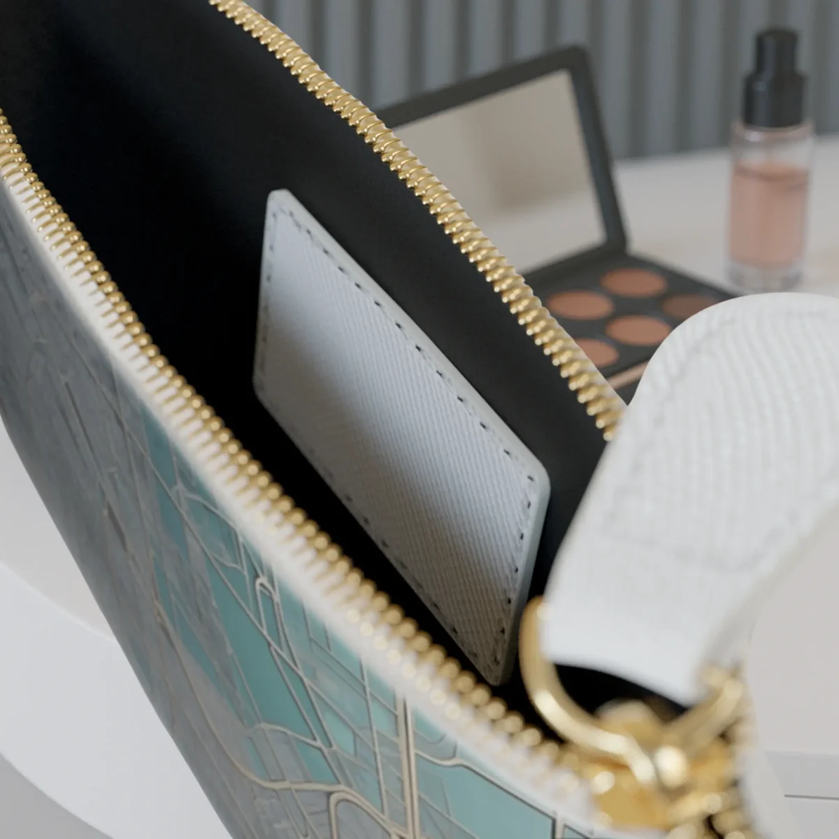 Close-up of the inside pocket of the Urban Grids mini clutch bag with visible zipper and white card slot.