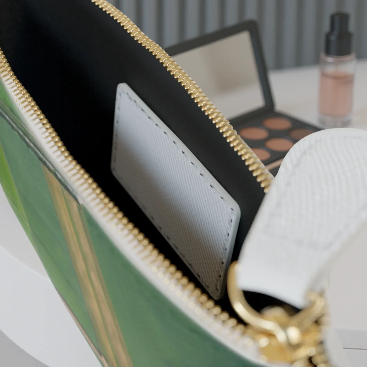 Close-up of the inside pocket of the View of Farmlands mini clutch bag with visible zipper and white card slot.