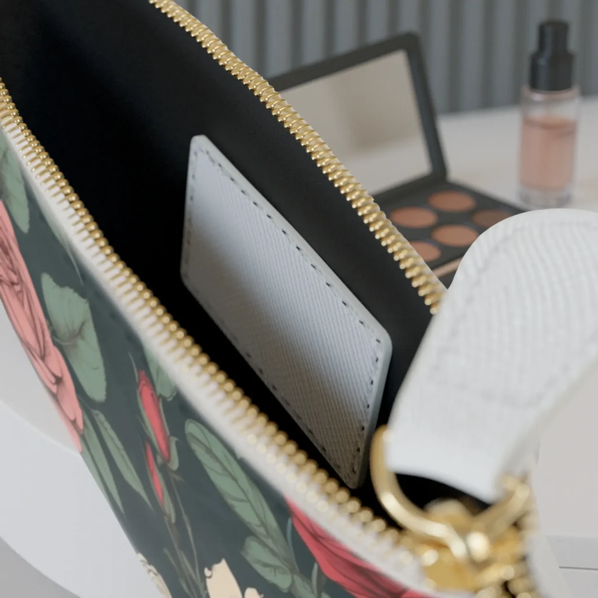 Close-up of the inside pocket of the Vintage Rose mini clutch bag with visible zipper and white card slot.