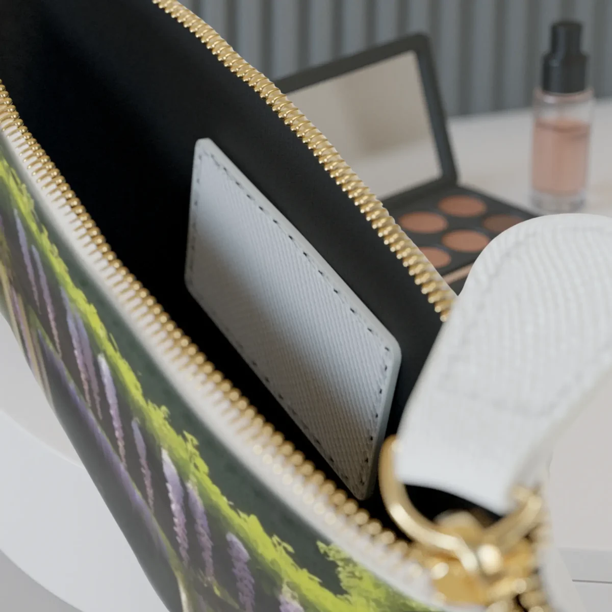 Close-up of the inside pocket of the Wisteria Vines mini clutch bag with visible zipper and white card slot.