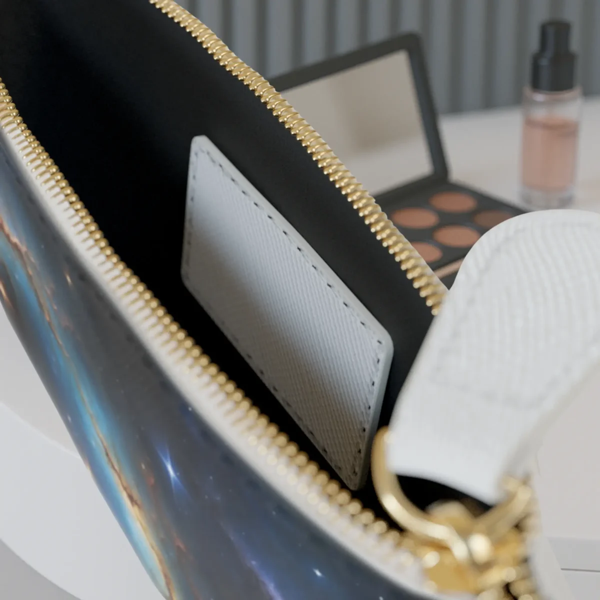 Interior view of mini clutch bag with galaxy-themed design and internal pocket