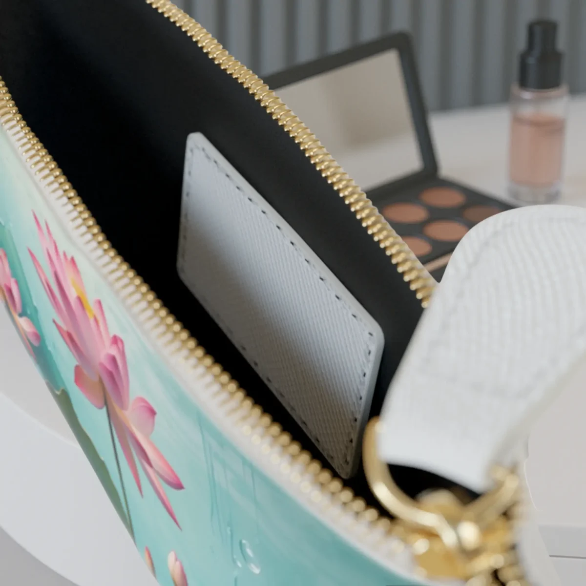Interior view of mini clutch bag with lotus flower exterior and card pocket