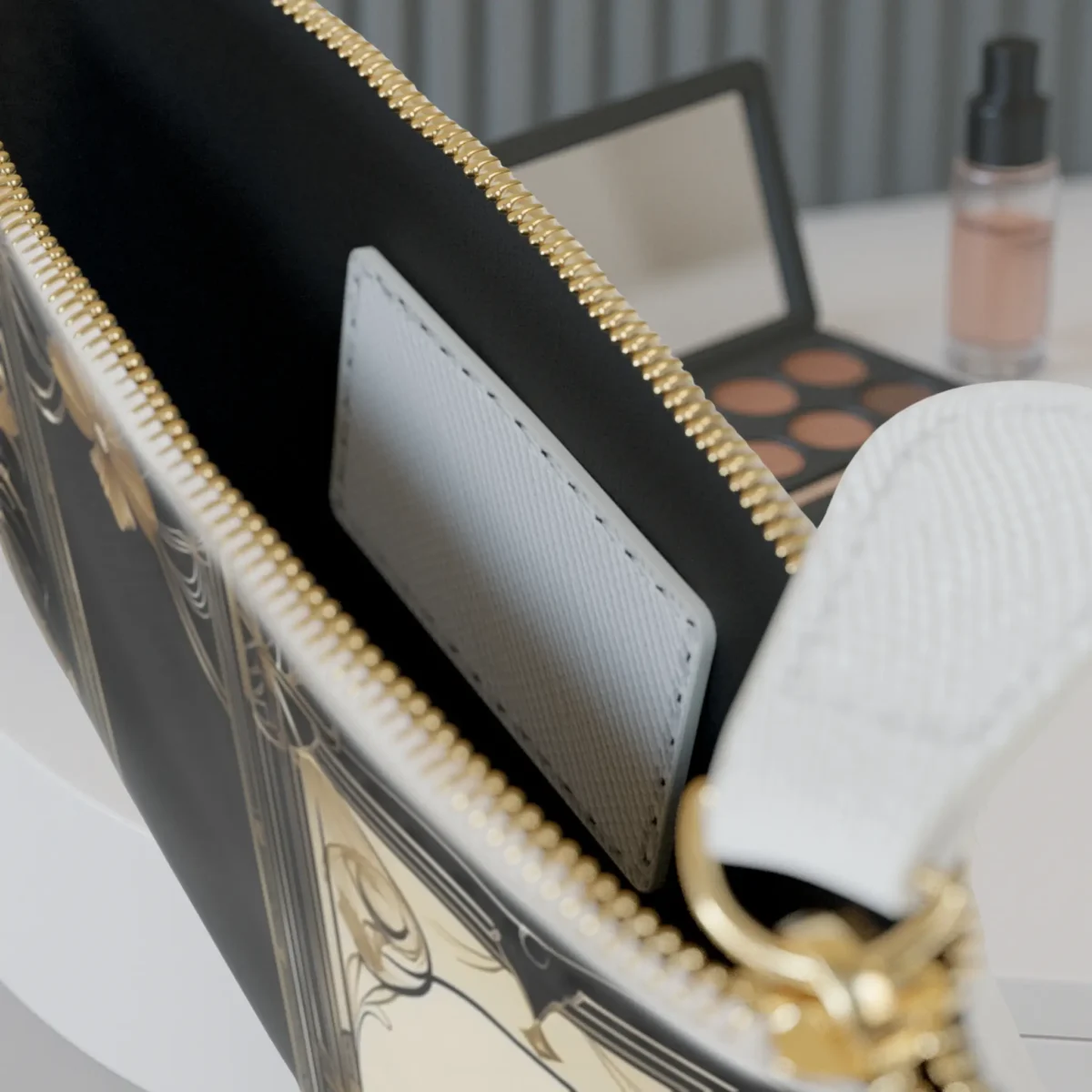 Close-up of the interior pocket of a mini clutch bag with gold zipper and Art Deco border design
