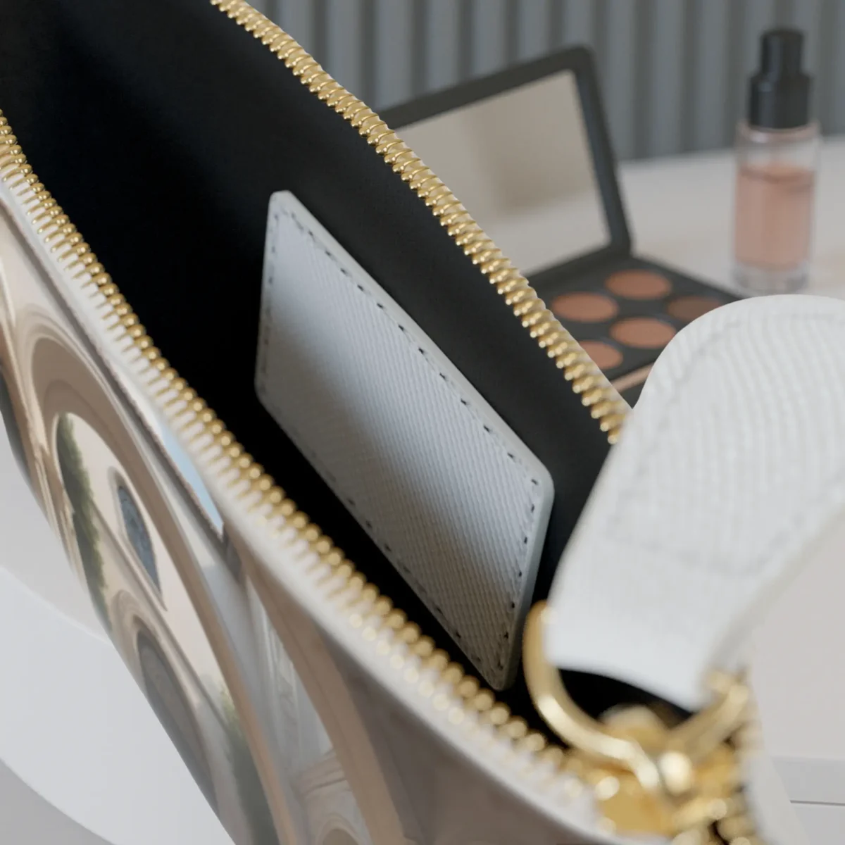 Interior of a luxury mini clutch bag with white textured insert and gold zipper