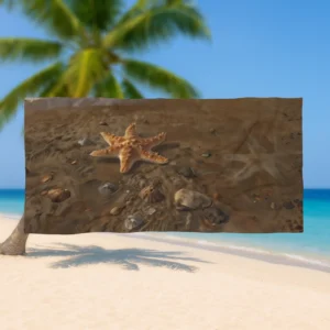 Flat view of a beach towel with a realistic starfish on sand and pebbles design held up on a tropical beach