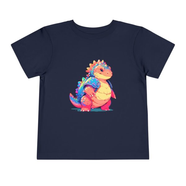 Toddler short sleeve tee with a smiling Ankylosaurus design on a navy blue background